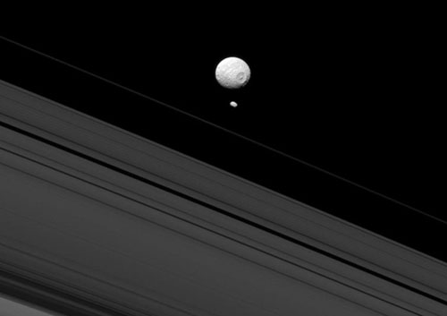 Saturn's moons Mimas (Death Star) and Pandora, as seen from above the rings by Cassini orbiter -- NASA photo.
